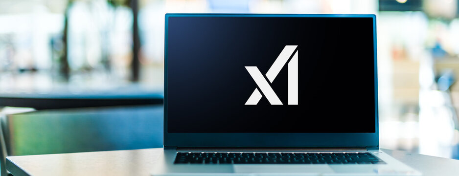 Laptop computer displaying logo of X.AI Corp
