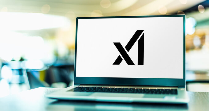 Laptop computer displaying logo of X.AI Corp
