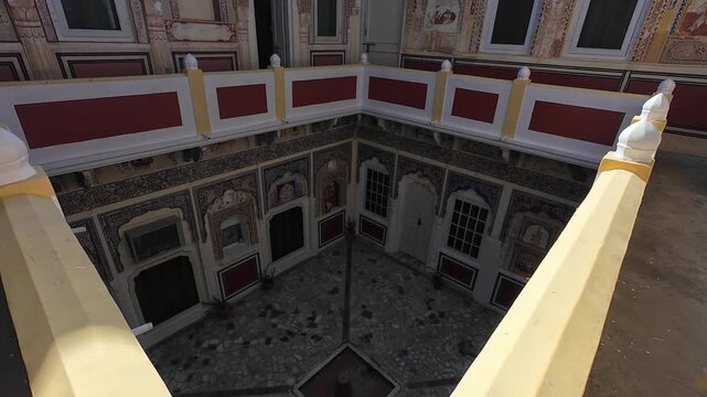 Historic Rajputana Haveli Architecture Showcasing Detailed Hand-Painted Art and Decorative Stone Arches within the Royal Fortress Mandawa Complex