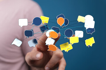Hand touching digital bubbles connecting network. Communication, social media, connection, community, and globa