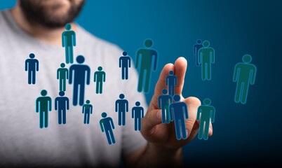 Hand interacting with digital people icons, representing social connection, networking, and online communities.