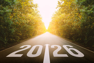 The new year 2026 or straightforward concept. number 2026 written on the road in forest. planning and challenge, business strategy, opportunity, hope, exit, and new life.