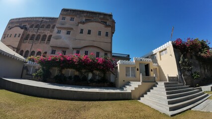 Panoramic View of the Grand Open Courtyard Inside Mandawa Fort Featuring Massive Heritage Walls and Garden Landscaping in Rajasthan