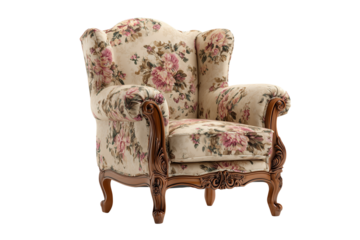 Classic wingback armchair with floral pattern and carved wooden details on isolated background