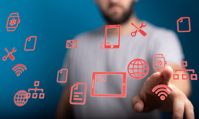 Abstract technology concept showing a man interacting with digital interface icons like wifi, document, and net