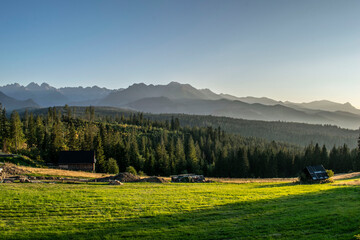 a picturesque panorama of the Tatra Mountains in the glow of the setting sun