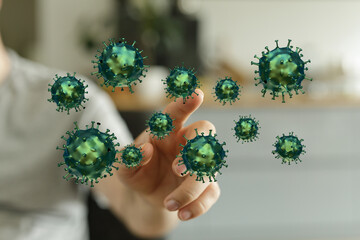 Conceptual image of a hand touching floating coronavirus particles, representing the spread of disease, infect