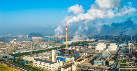 Aerial view of an oil refinery and chemical plant with smoking chimneys in industrial area
