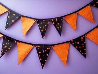 Two layers of colorful dotted orange and black bunting flags hanging on a soft purple background, creating a playful party atmosphere