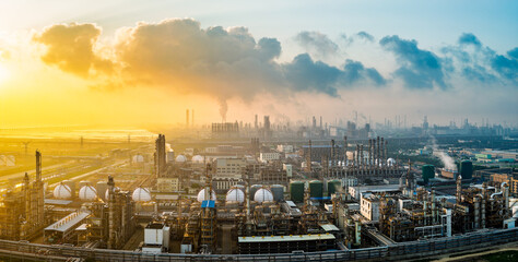 Aerial shot of a large chemical plant and oil refinery with smoking chimneys in industrial area
