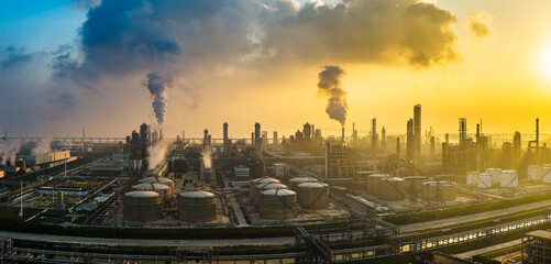 Aerial shot of a large chemical plant and oil refinery with smoking chimneys in industrial area
