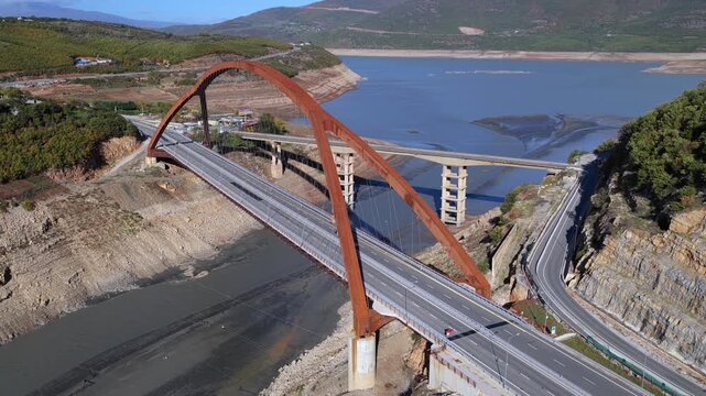 Aerial video of the A1 motorway crossing the Drin Valley near Kuk&euml;s, featuring the new Kuk&euml;s Bridge and surrounding autumn landscapes.