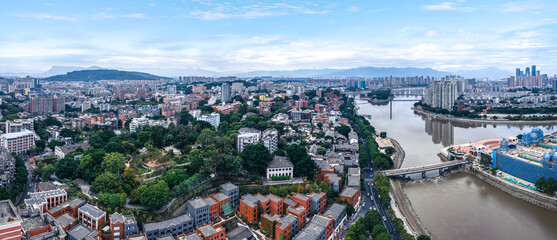 Obraz premium Aerial View of Urban Cityscape with River and Bridges