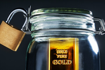 A gold bar, protected, locked, symbolizes financial security,  protection from risk.