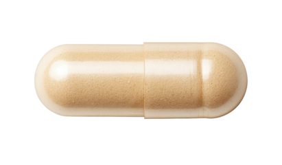 Close-up of a beige pill against a black background
