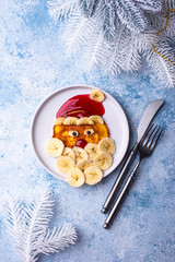 Pancakes in the shape of Santa Claus