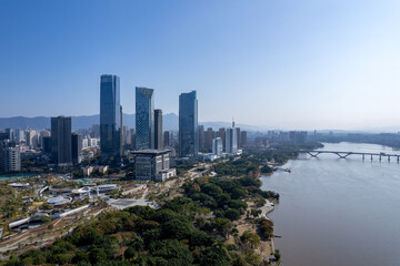 Modern Skyscrapers Along River in Urban Area