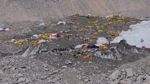 Everest Base Camp Colorful Tents and Climbers in Himalayas
