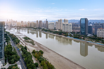 Urban Riverfront with Modern Skyscrapers