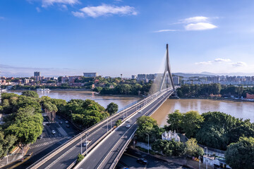 Aerial View of Modern Suspension Bridge Over River