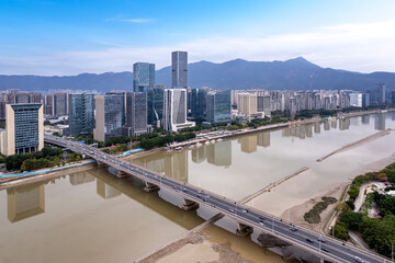 Aerial View of Urban Riverfront with Skyscrapers