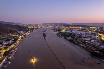 Twilight Aerial View of River and Cityscape