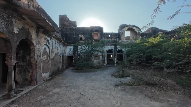 Historic Ruins of the 18th Century Deogarh Fortress Showcasing Crumbling Rajputana Architecture and Wild Foliage Reclaiming the Deserted Palace Walls