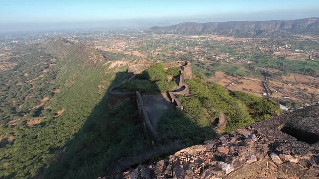 Exploring the Historic Fortress of Deogarh Featuring Weathered Stone Fortifications and Strategic Defensive Structures on a Rugged Hilltop Landmark, Sikar, Rajasthan