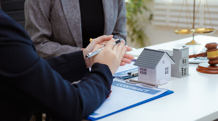 Justice and law concept. agent asking costumer for contract to buy, get insurance or loan real estate or property.