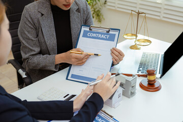 Justice and law concept. Real Estate Law in a courtroom the gavel, working with digital tablet computer.