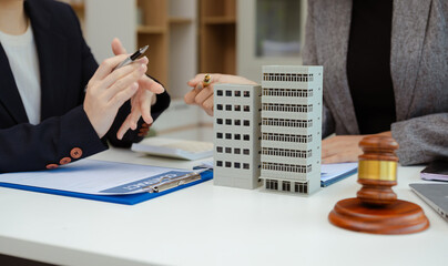 Real Estate Law in a courtroom the gavel, working with digital tablet computer.