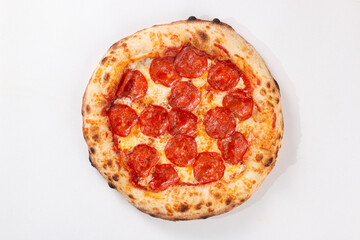 Top view pepperoni pizza with spicy salami melted cheese and baked crust isolated