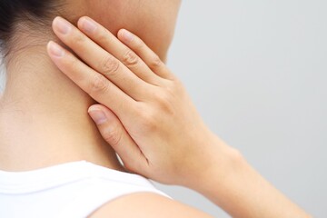 Fototapeta premium Neck, shoulder, and upper back pain is usually caused by a muscle injury. broken pillow 