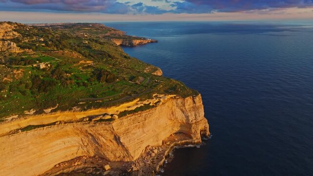 Drone aerial view of famous sunset spot. Countryside, rocks, hills. Dingli cliffs, Mediterranean sea, Malta island