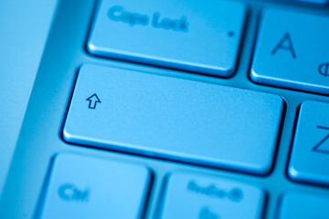 Close-up computer keyboard keys, top view.