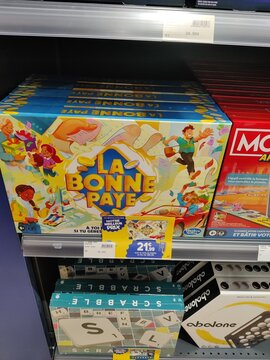 Saintes, France - December 17, 2025: Joue Club. Colorful board game "La Bonne Paye" displayed on store shelf, showcasing vibrant artwork and engaging characters for family fun and entertainment