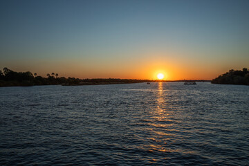 Cruising the Zambezi River, in Zimbabwe, Africa, at sunset