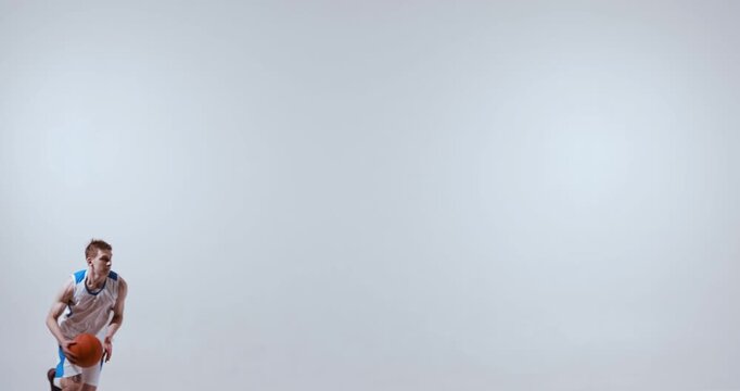 Basketball player performing slam dunk motion with ball in one hand. Concept of creative movement references, sports animation sources, dynamic sequences, and athlete body motion study.