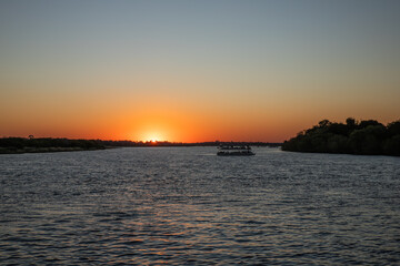 Cruising the Zambezi River, in Zimbabwe, Africa, at sunset