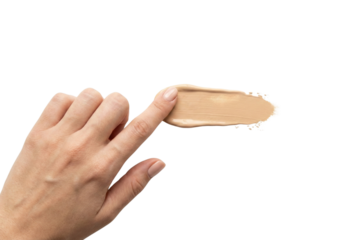 Finger applying liquid foundation smear