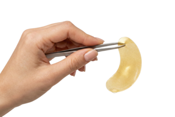 Hand holding hydrogel eye patch