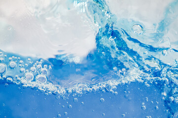 Closeup Transparent blue clear water surface texture with ripples. Abstract​ of​ surface​ blue​ splashes and bubbles​ water waves  reflected​ with​ sunlight​
