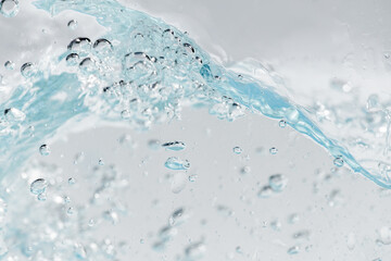 Closeup Transparent blue clear water surface texture with ripples. Abstract​ of​ surface​ blue​ splashes and bubbles​ water waves  reflected​ with​ sunlight​