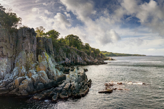 drone view of the Sanctuary Rock cliffs and North Sea on the north side of the Danish island of Bornholm
