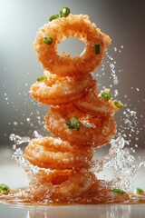 floating calamari rings with tartar sauce splash, isolated on white background