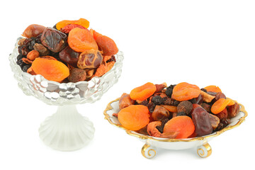 Assortment of Dried Fruits in Elegant Glass and Porcelain Bowls