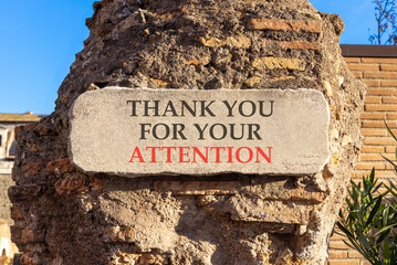 Thank you for your attention symbol. Concept words Thank you for your attention on white marble sign plate. Beautiful brick column background. Business thank you for your attention concept. Copy space