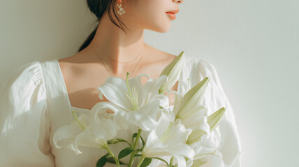 日本人女性が白い百合を持つ