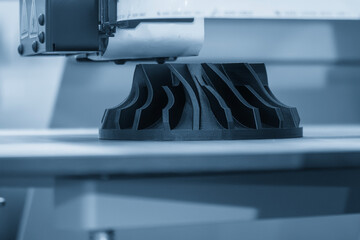 Close up scene the 3D model operation by additive manufacturing by 3D printer machine in the blue tone. The high technology manufacturing process by rapid prototype method.