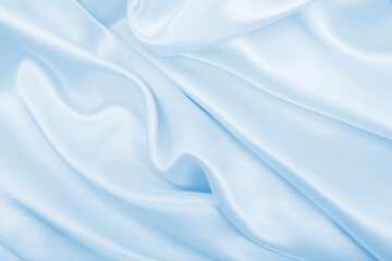 Fototapeta premium Smooth elegant blue silk or satin luxury cloth texture as abstract background. Luxurious background design